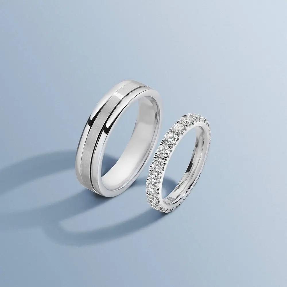 Image 19: Pair of matching platinum wedding bands with a smooth finish